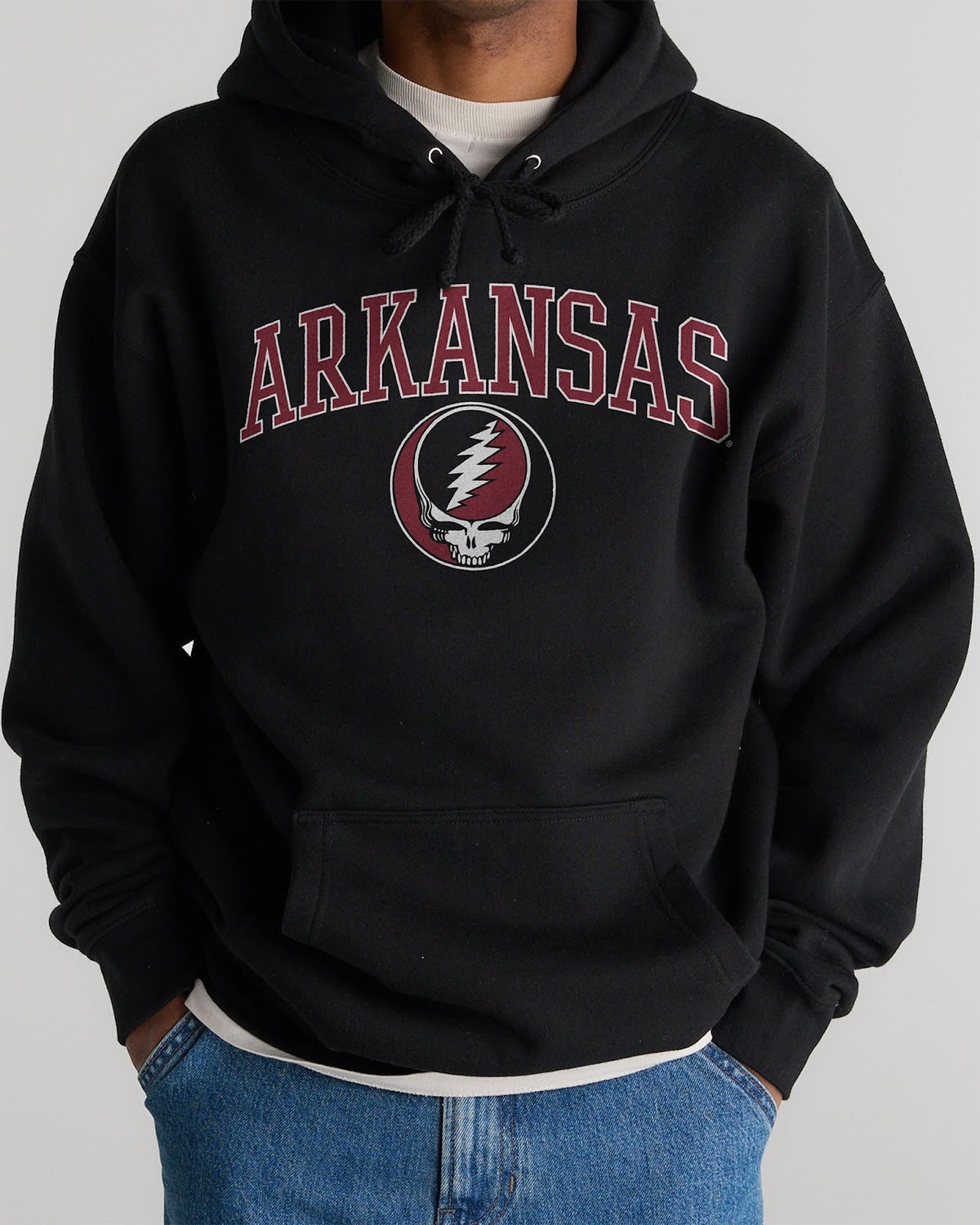 Model wearing the Black Arkansas x Grateful Dead Arch SYF Hoodie, front view. Class Trip | Higher Education