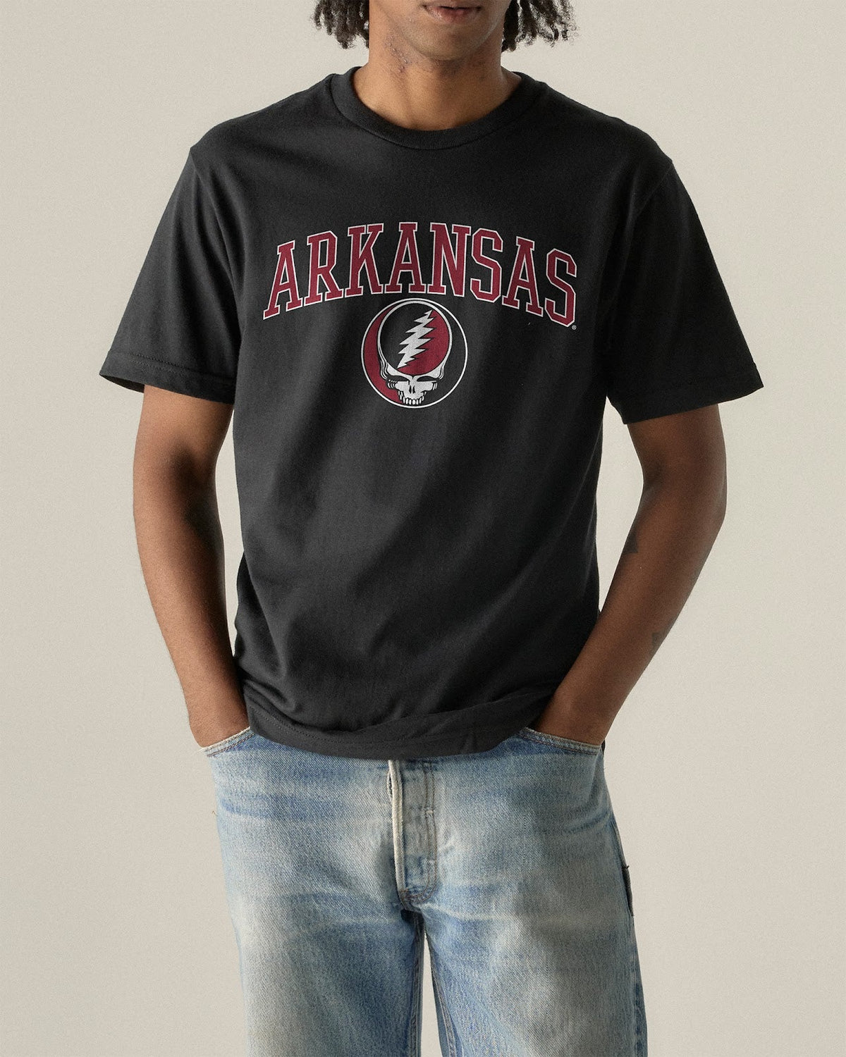 Model wearing the Black Arkansas x Grateful Dead Arch SYF Tee, front view. Class Trip | Higher Education