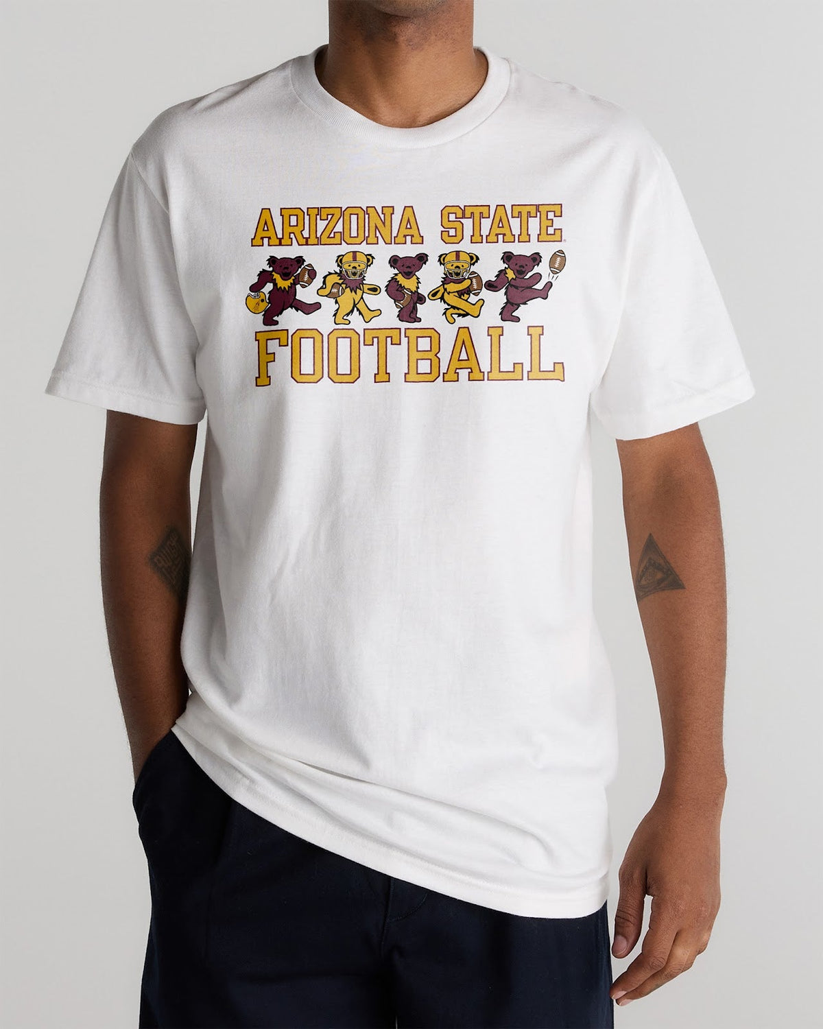 Model wearing the White Arizona State x Grateful Dead Football Bears Tee, front view. Class Trip | Higher Education
