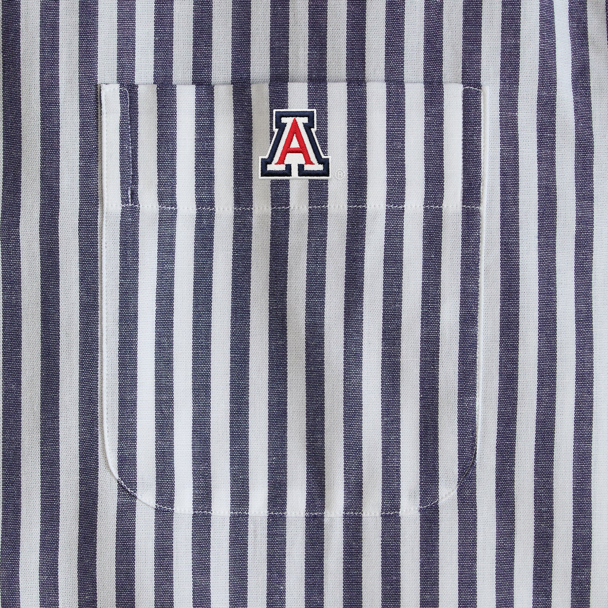 Navy and white striped collegiate shirt with embroidered 'A' logo on chest pocket. Class Trip | Officially Licensed Collegiate Apparel