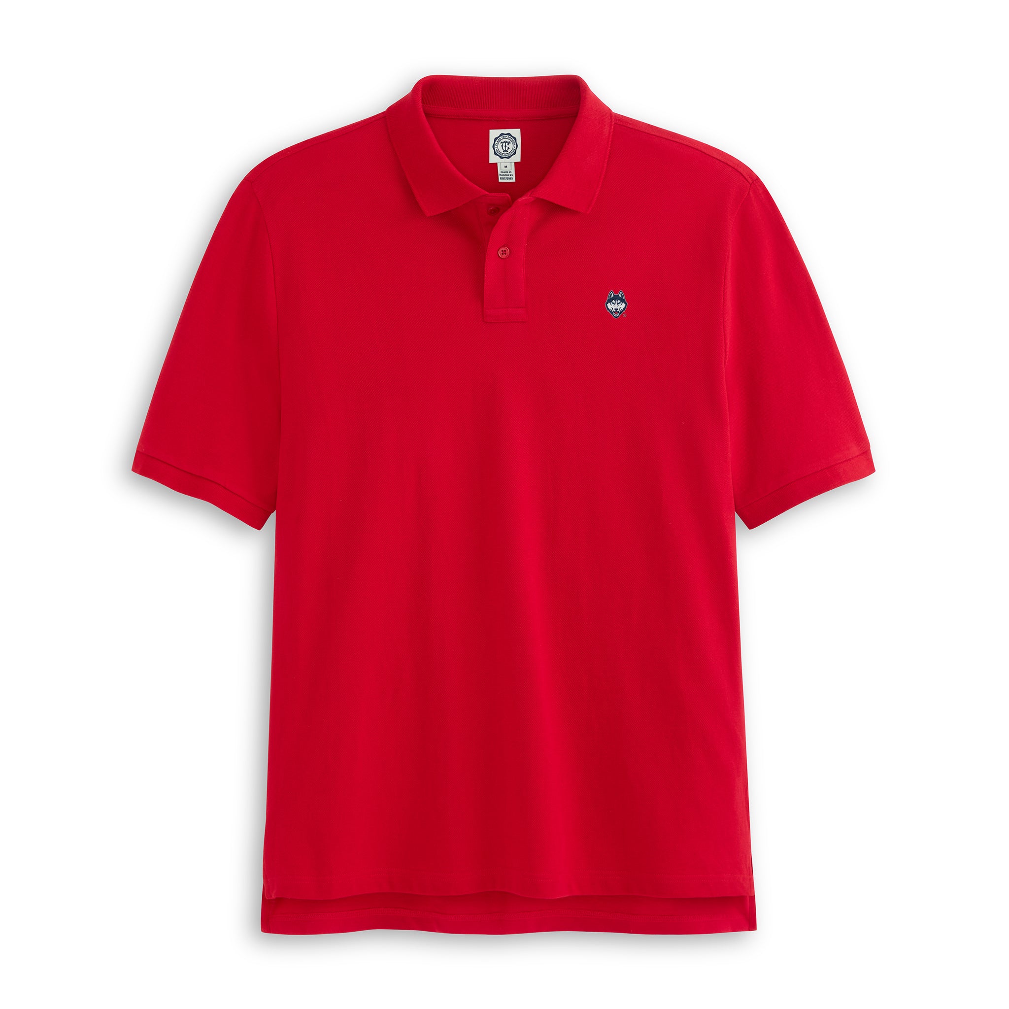 Red pique polo shirt with collegiate logo patch on chest, short sleeves, flat lay. Class Trip | Officially Licensed Collegiate Apparel