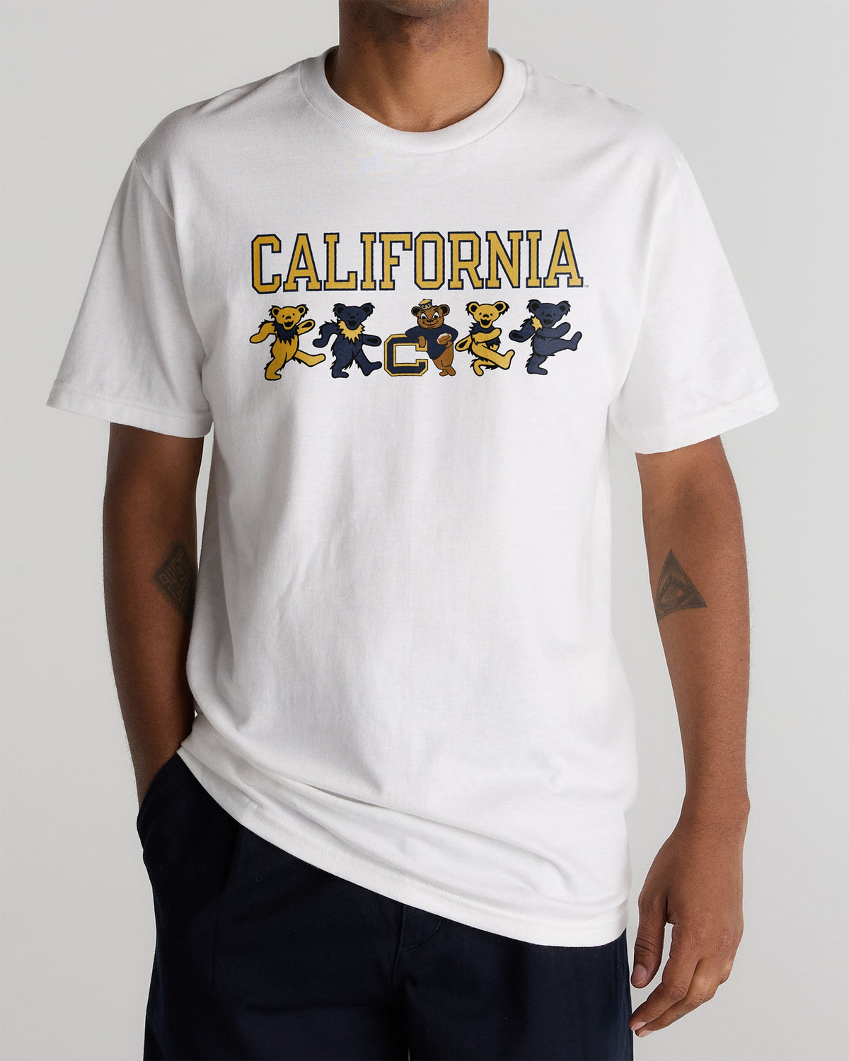 Model wearing the White Cal Berkeley x Grateful Dead Mascot Bears Tee, front view. Class Trip | Higher Education