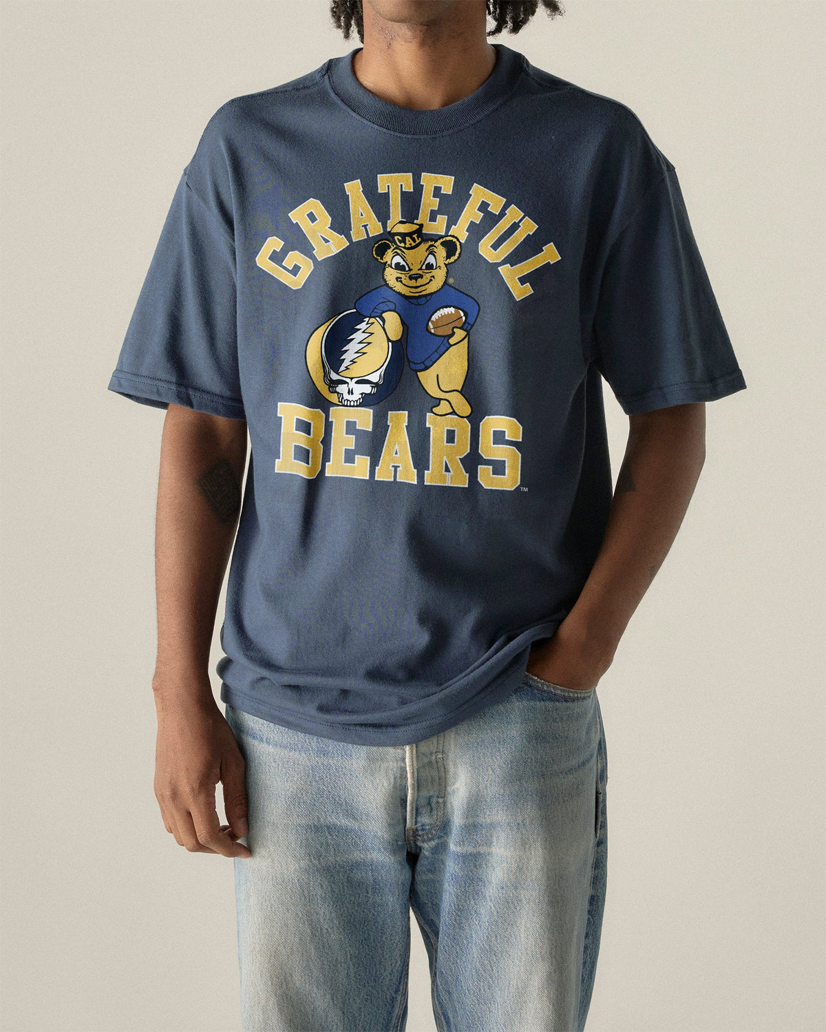 Model wearing the Navy Cal Berkeley x Grateful Dead Grateful Bears Tee, front view. Class Trip | Higher Education