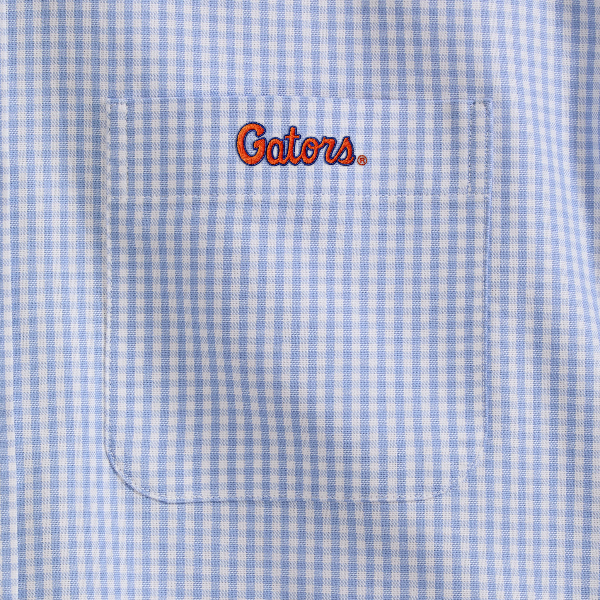 Light blue checked men's oxford shirt pocket with orange Gators embroidery. Class Trip | Officially Licensed Collegiate Apparel