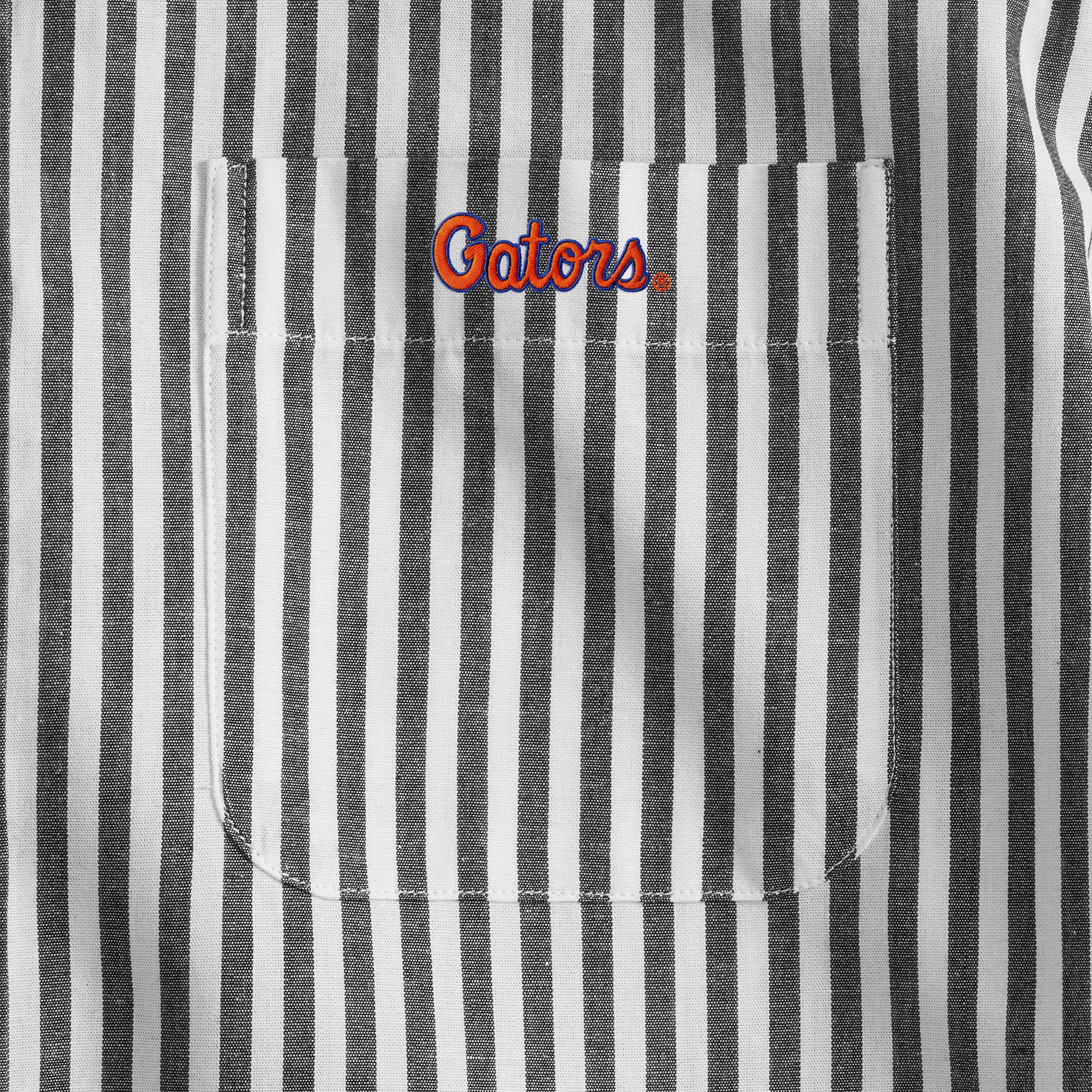 Close-up of black and white striped men's shirt pocket with Gators logo, Class Trip | Officially Licensed Collegiate Apparel