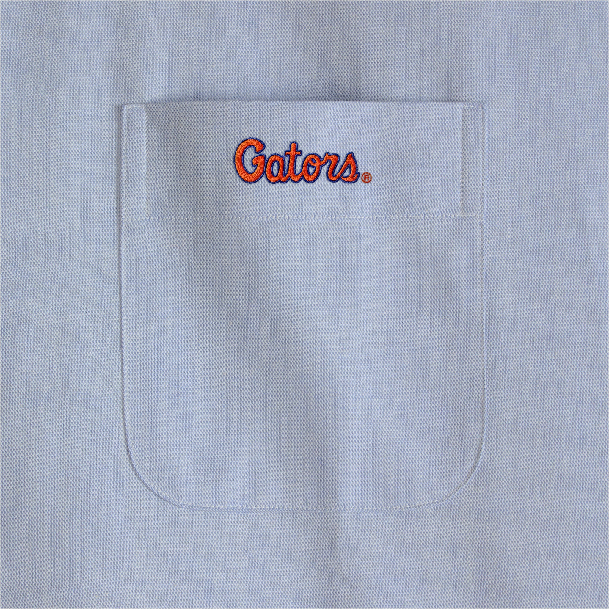 Light blue oxford shirt pocket with embroidered Gators logo. Class Trip | Officially Licensed Collegiate Apparel