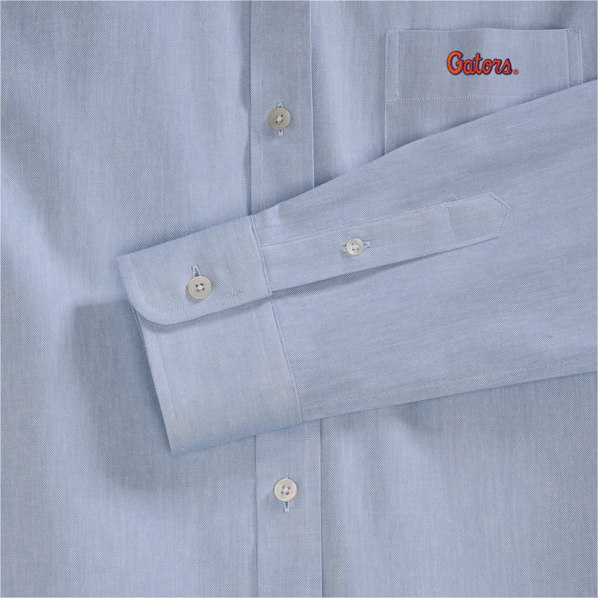 Light blue women's oxford shirt with embroidered collegiate logo on chest pocket. Class Trip | Officially Licensed Collegiate Apparel