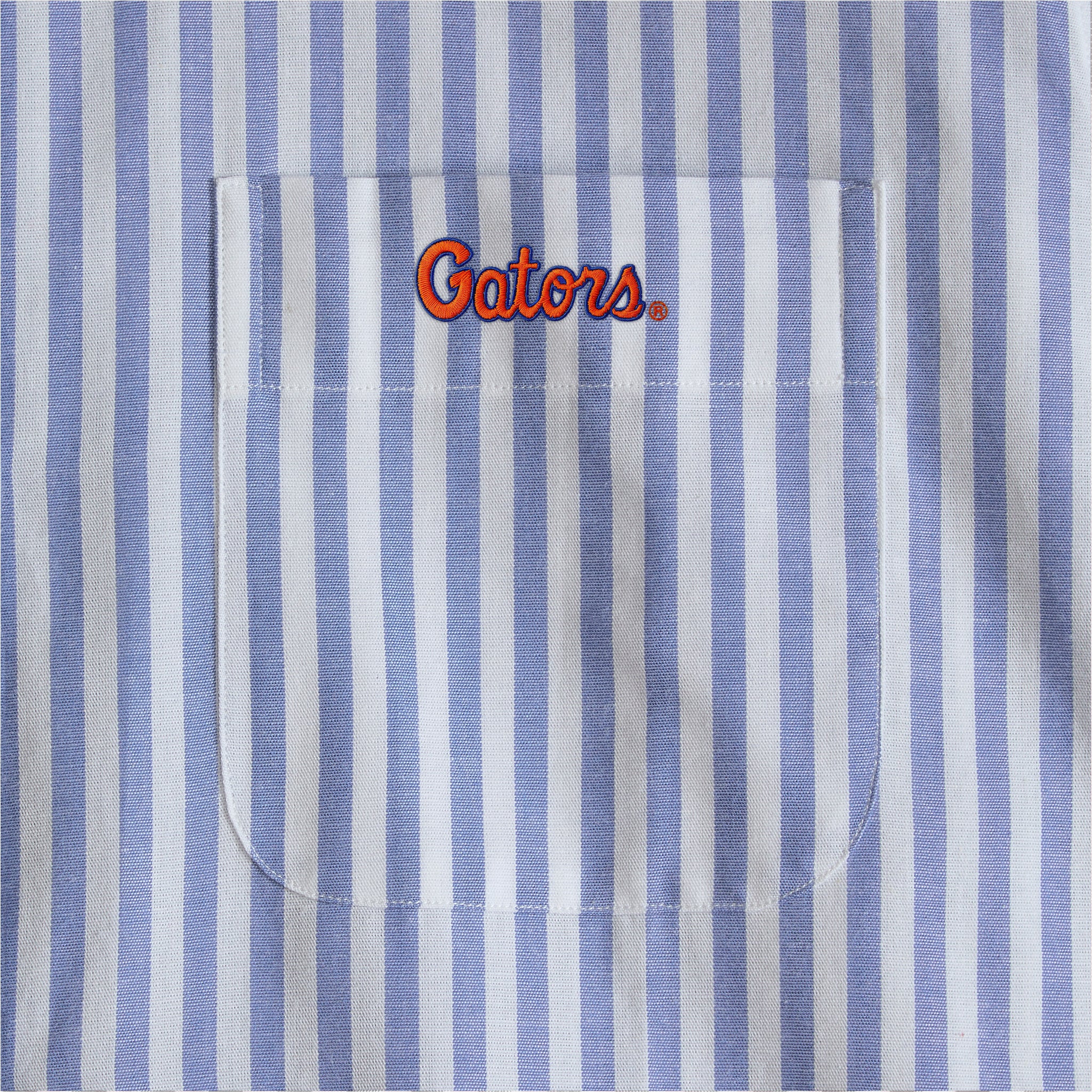 Blue and white striped poplin shirt pocket with Gators embroidered logo. Class Trip | Officially Licensed Collegiate Apparel