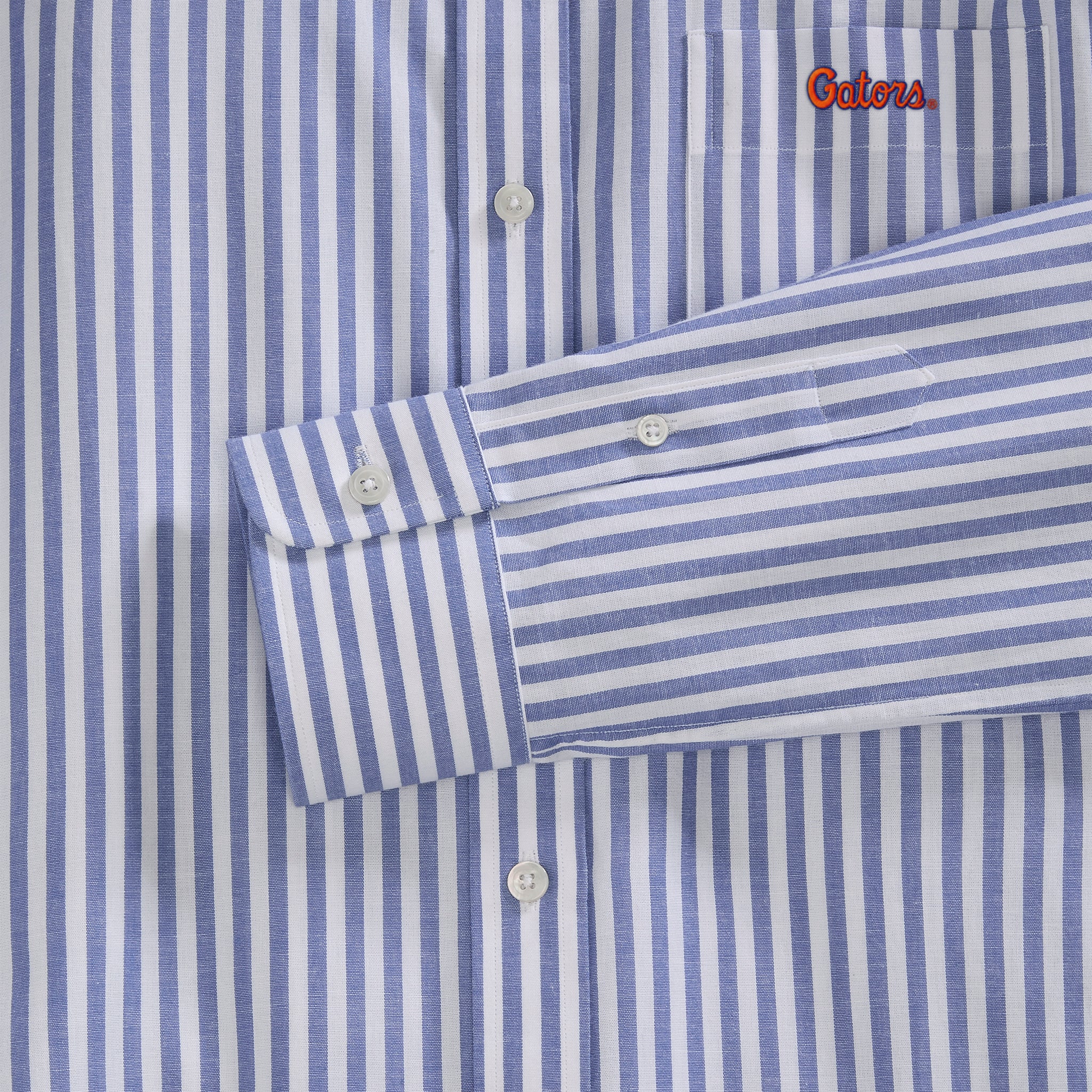 Blue and white striped women's poplin shirt with 'Gators' embroidery, cuff and buttons detail. Class Trip | Officially Licensed Collegiate Apparel