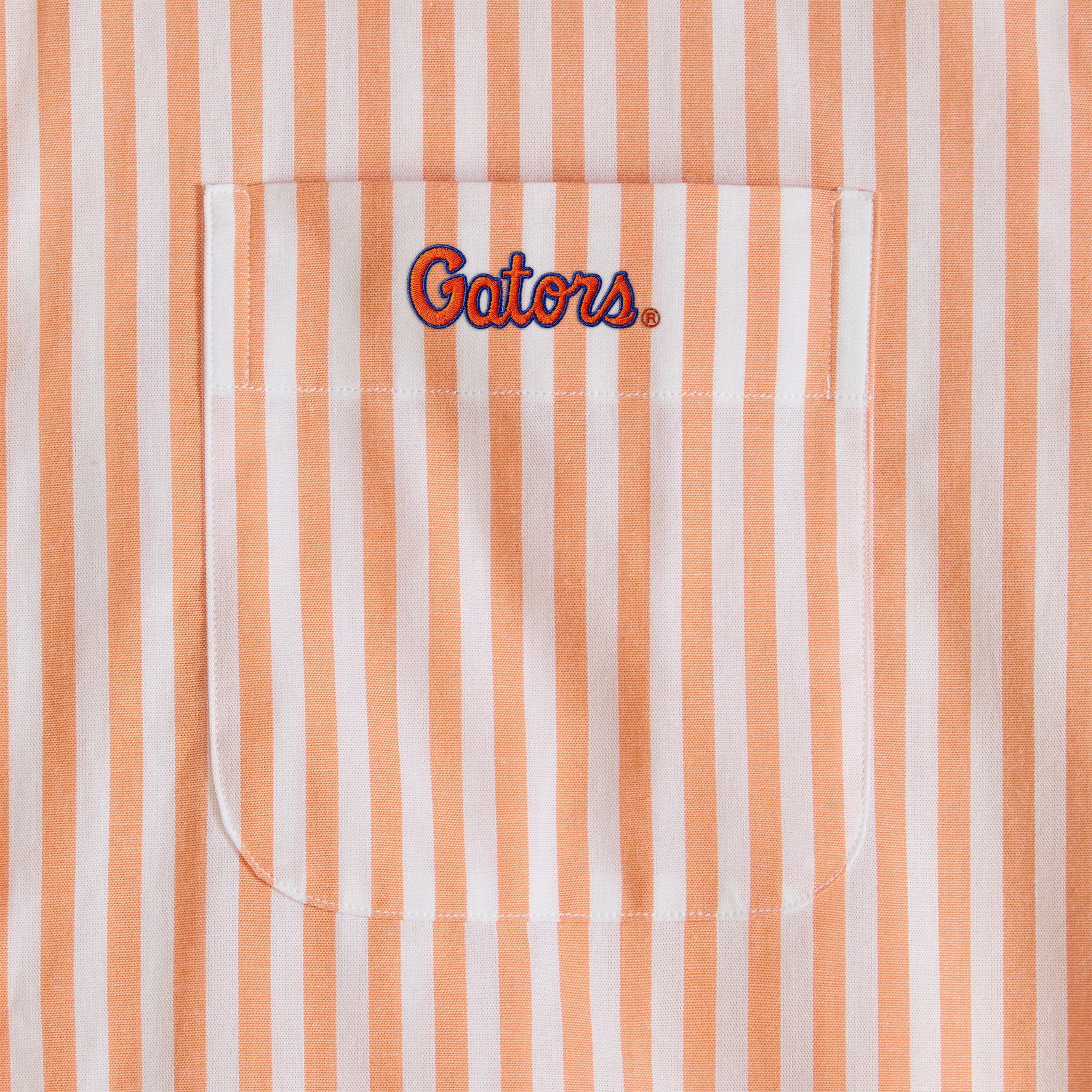 Orange and white striped poplin shirt pocket with Gators embroidery. Class Trip | Officially Licensed Collegiate Apparel