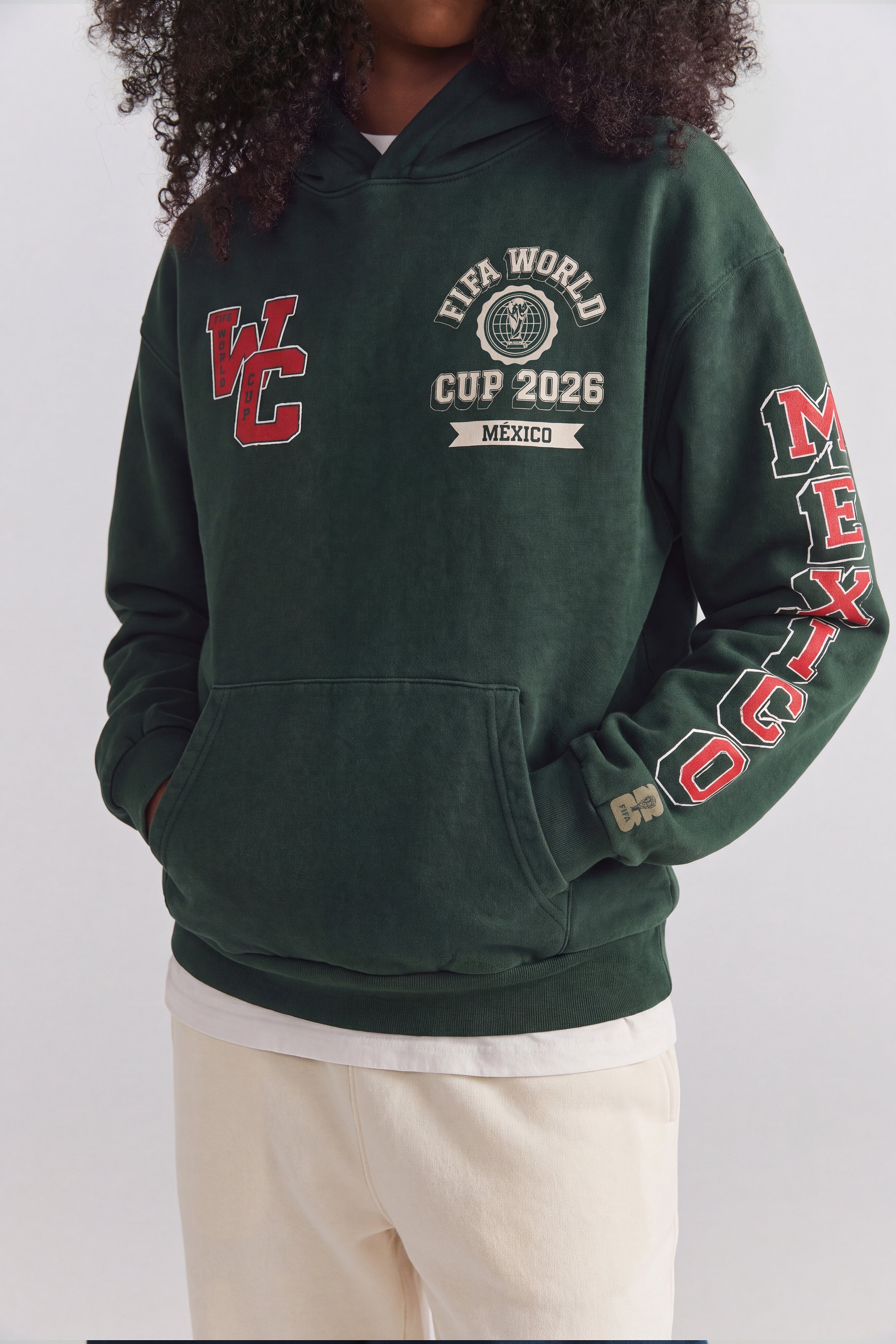 Green FIFA World Cup 2026 Mexico hoodie with vintage graphics and sleeve lettering. Class Trip | Higher Education