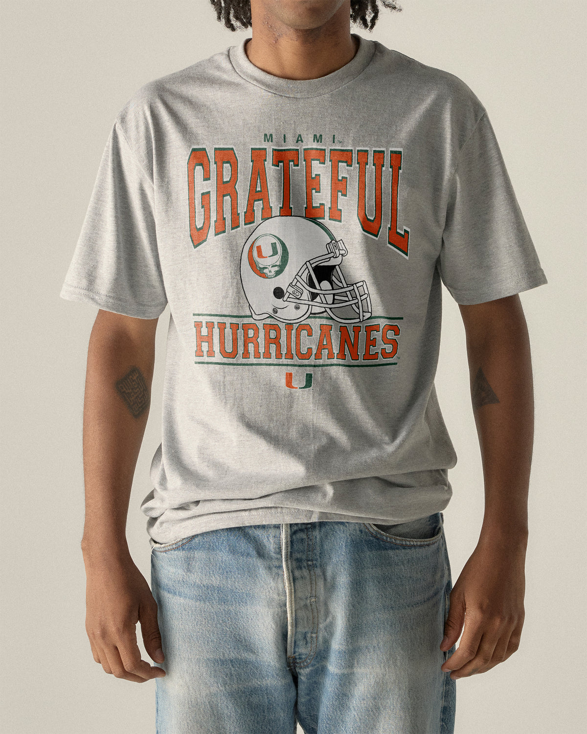 Grey University of Miami x Grateful Dead tee with helmet graphic. University of Miami x Grateful Dead Steal Your Helmet Tee Class Trip | Higher Education