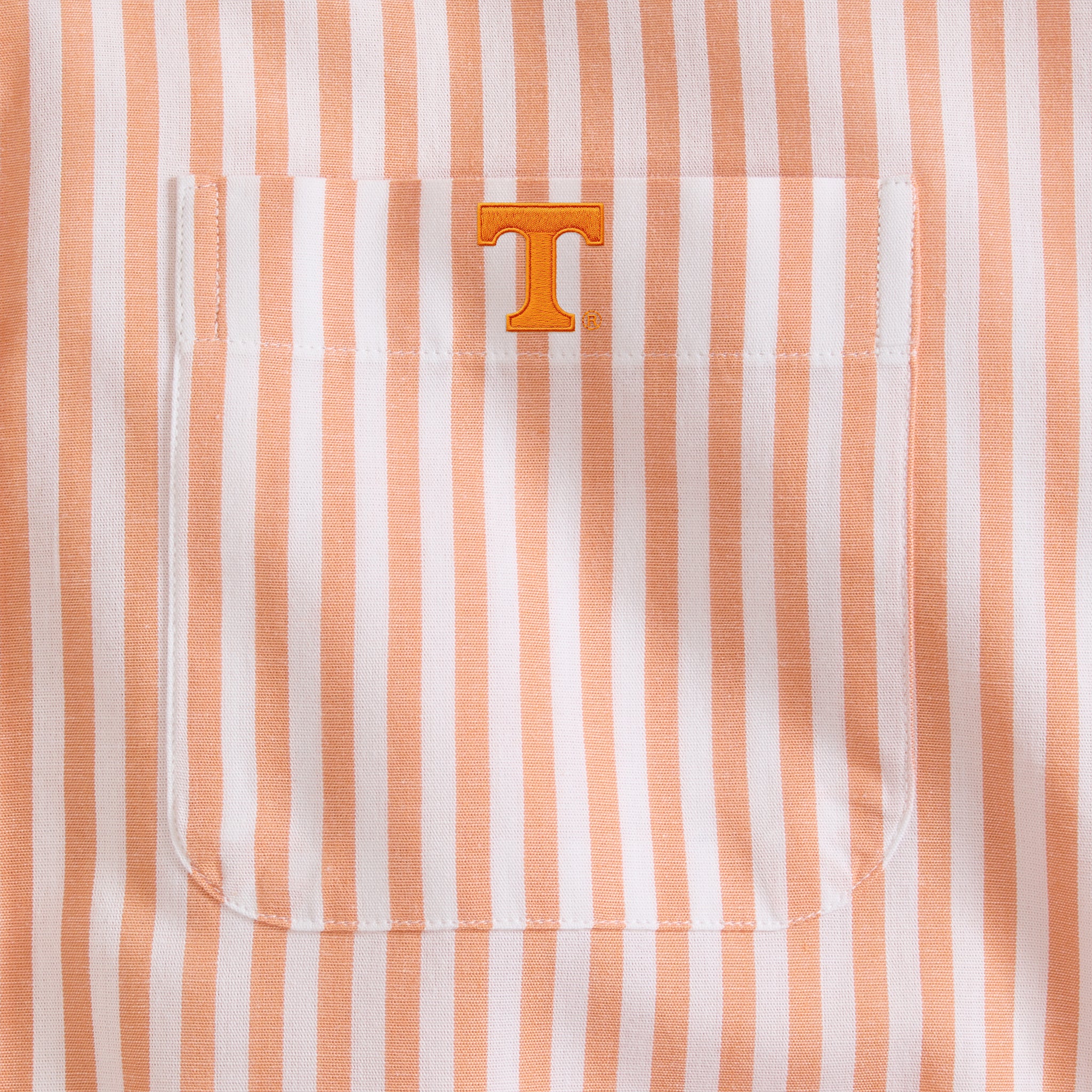 Men's orange and white striped poplin shirt pocket with embroidered letter T. Class Trip | Officially Licensed Collegiate Apparel