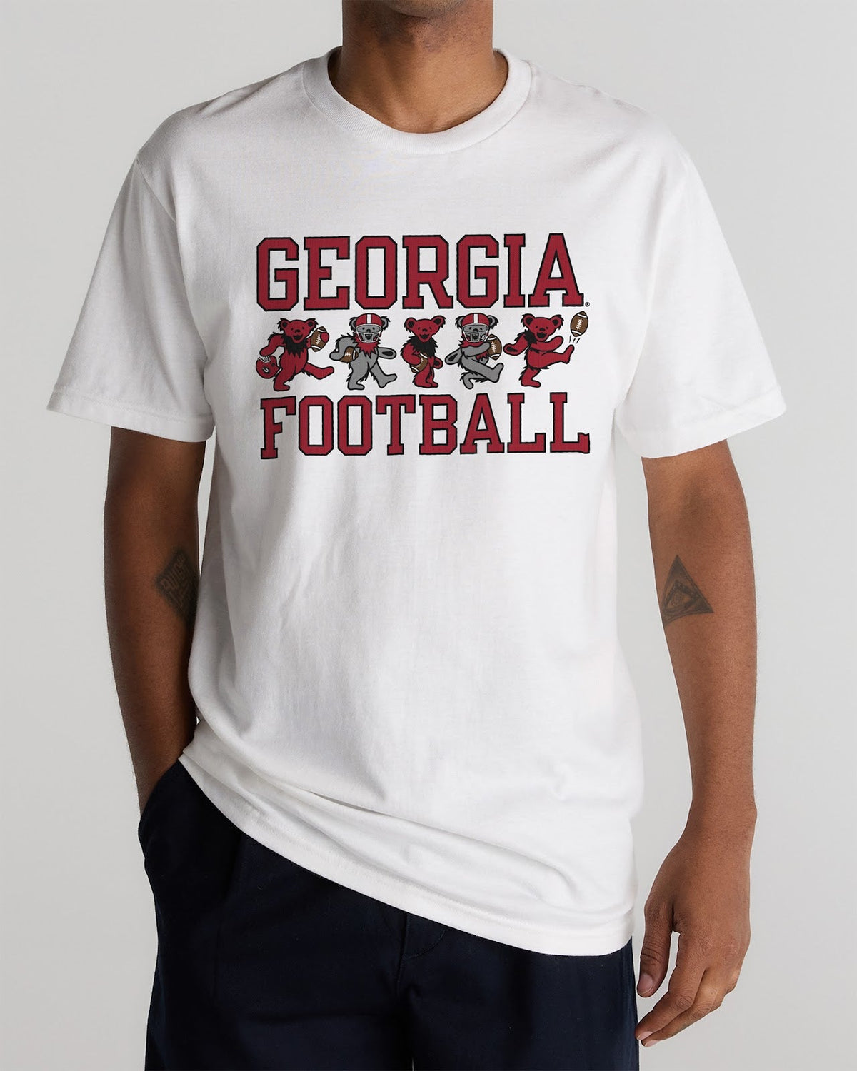 Model wearing the White Georgia x Grateful Dead Football Bears Tee, front view. Class Trip | Higher Education