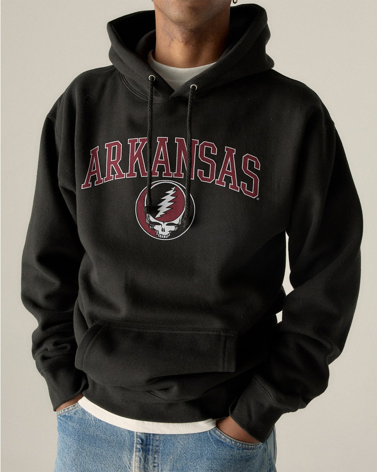 Model wearing the Black Arkansas x Grateful Dead Arch SYF Hoodie, front view. Class Trip | Higher Education