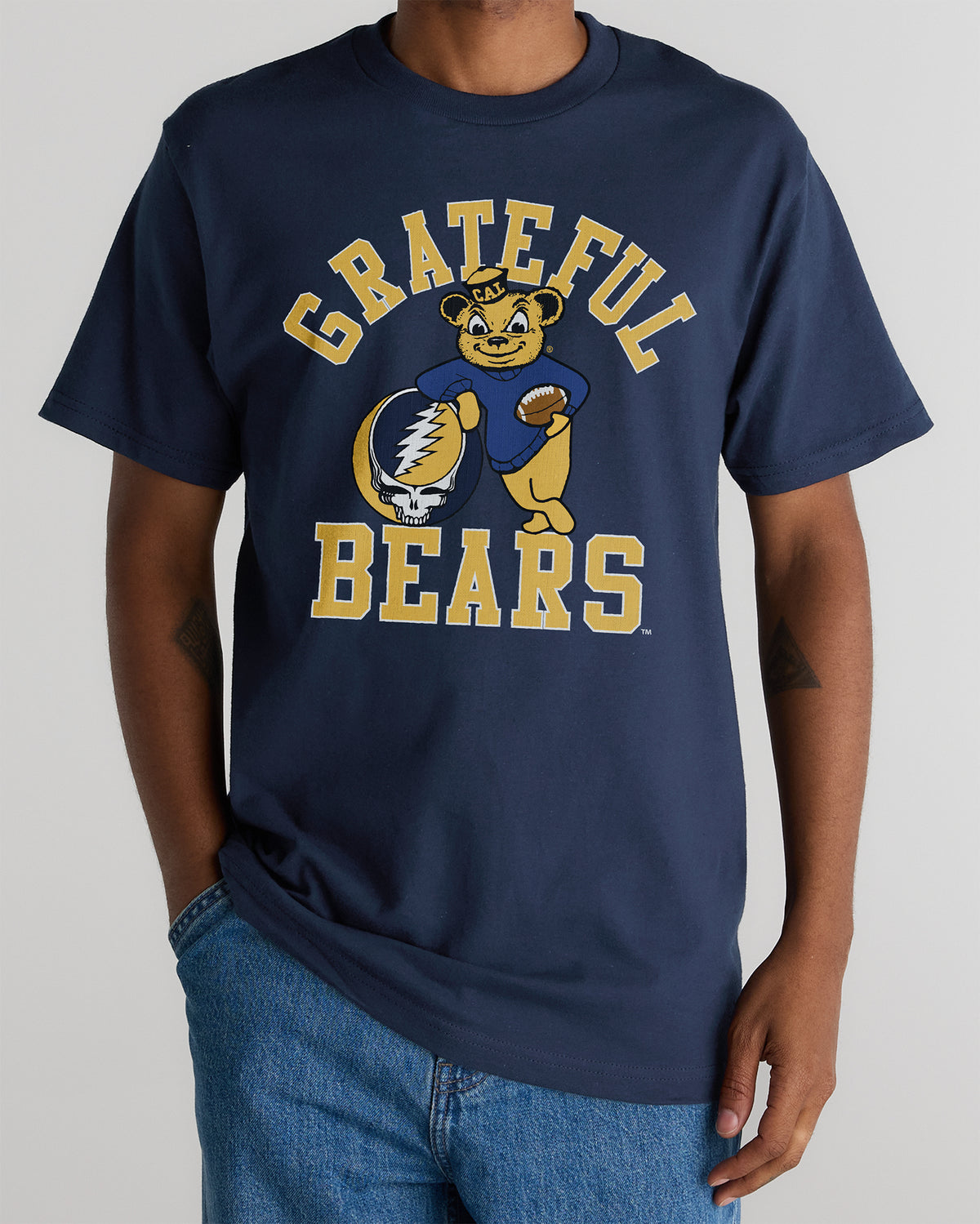 Model wearing the Navy Cal Berkeley x Grateful Dead Grateful Bears Tee, front view. Class Trip | Higher Education