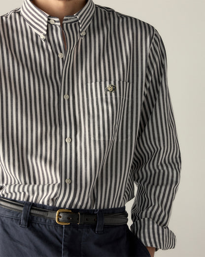Men's black and white striped button-up shirt with university logo on pocket. Class Trip | Officially Licensed Collegiate Apparel