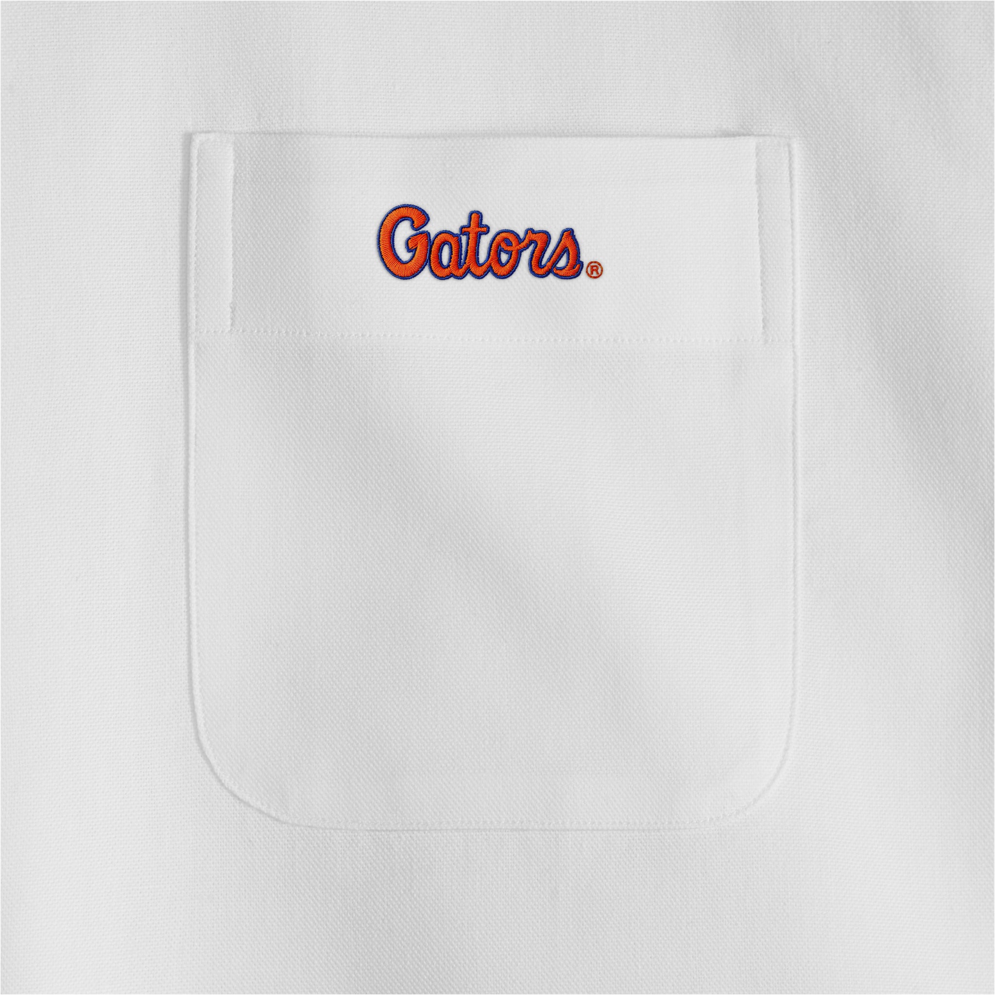 White women's oxford shirt pocket with Gators embroidery, collegiate apparel. Class Trip | Officially Licensed Collegiate Apparel