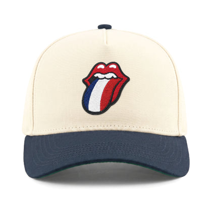 Cream and navy baseball cap with embroidered Rolling Stones tongue logo. Class Trip | Higher Education