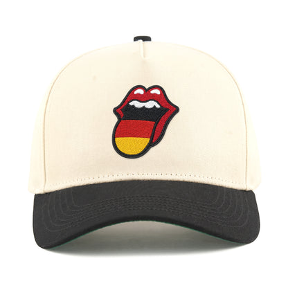 Cream and black baseball cap with embroidered Rolling Stones tongue logo in German flag colors. Class Trip | Higher Education