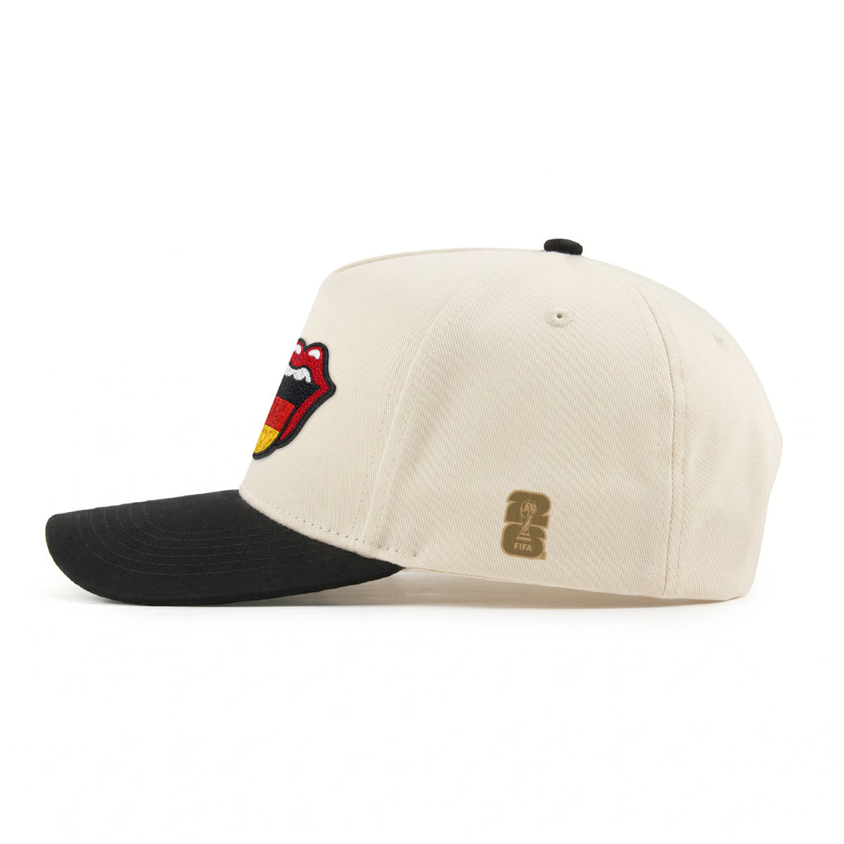 Cream and black cap with embroidered Rolling Stones tongue logo and FIFA World Cup patch. Class Trip | Higher Education