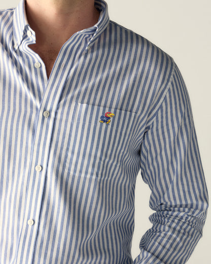 Men's blue and white striped button-down shirt with college logo patch. Class Trip | Officially Licensed Collegiate Apparel
