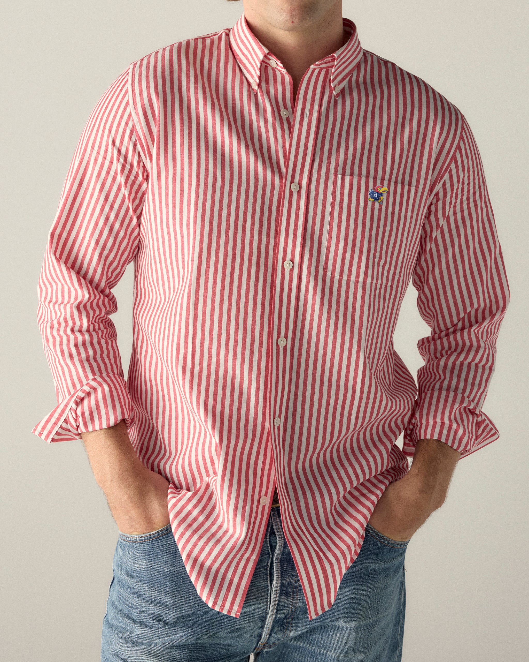 Men's red and white striped button-up shirt with embroidered collegiate logo, casual fit. Class Trip | Officially Licensed Collegiate Apparel