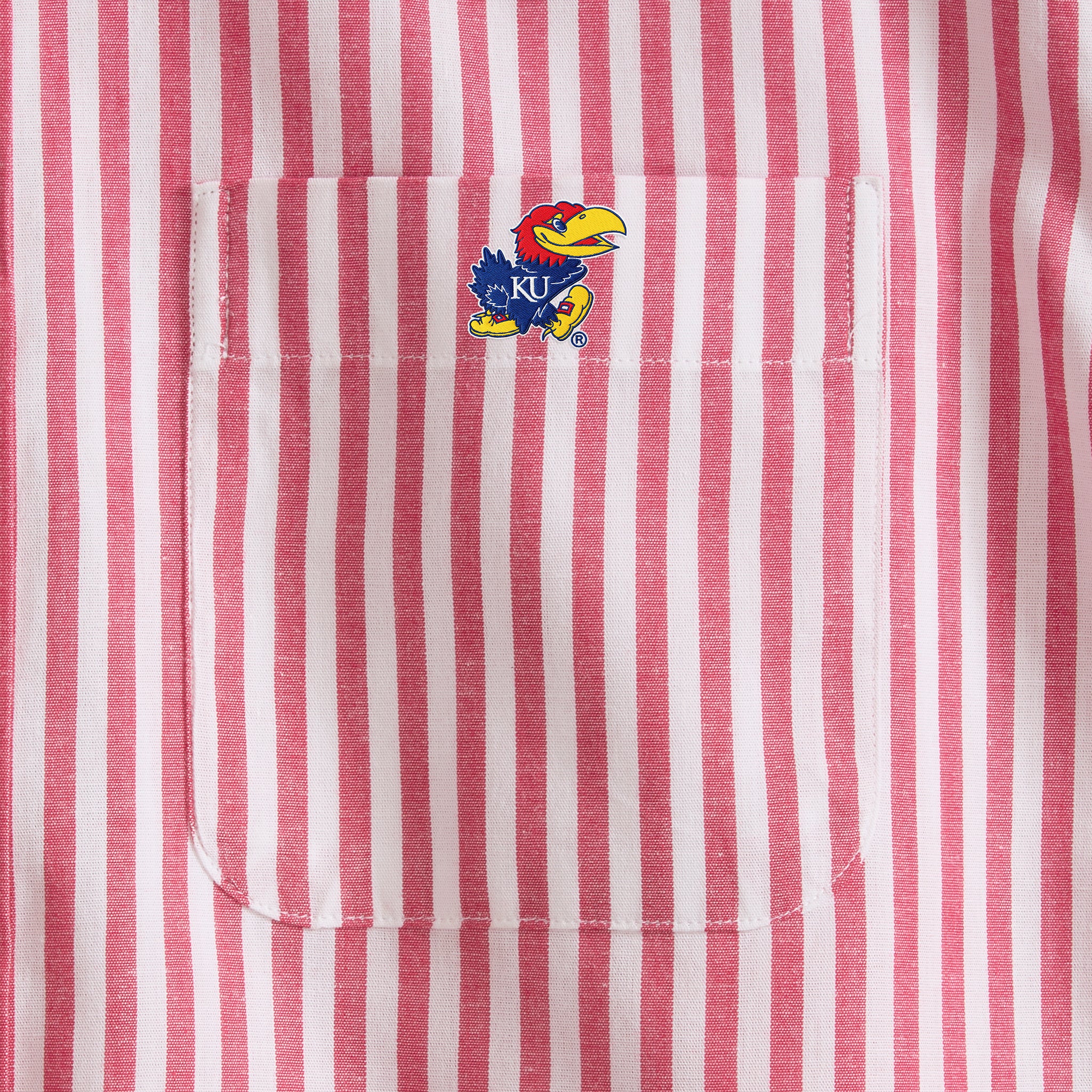 Closeup of red and white striped shirt pocket with collegiate logo, Class Trip | Officially Licensed Collegiate Apparel