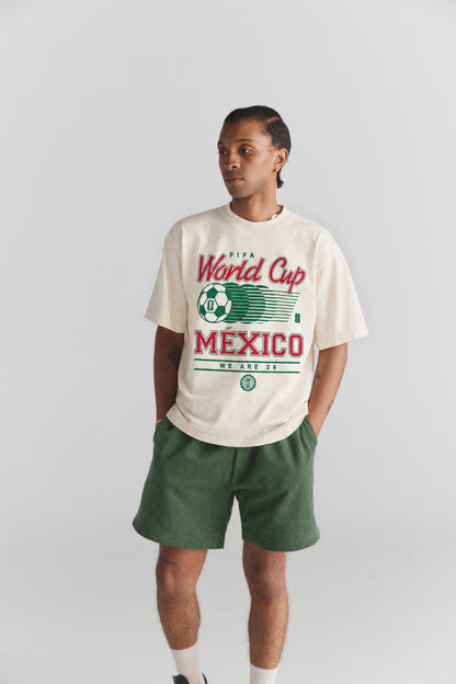 Cream FIFA World Cup Mexico graphic tee with green shorts, vintage soccer apparel | Class Trip | Higher Education