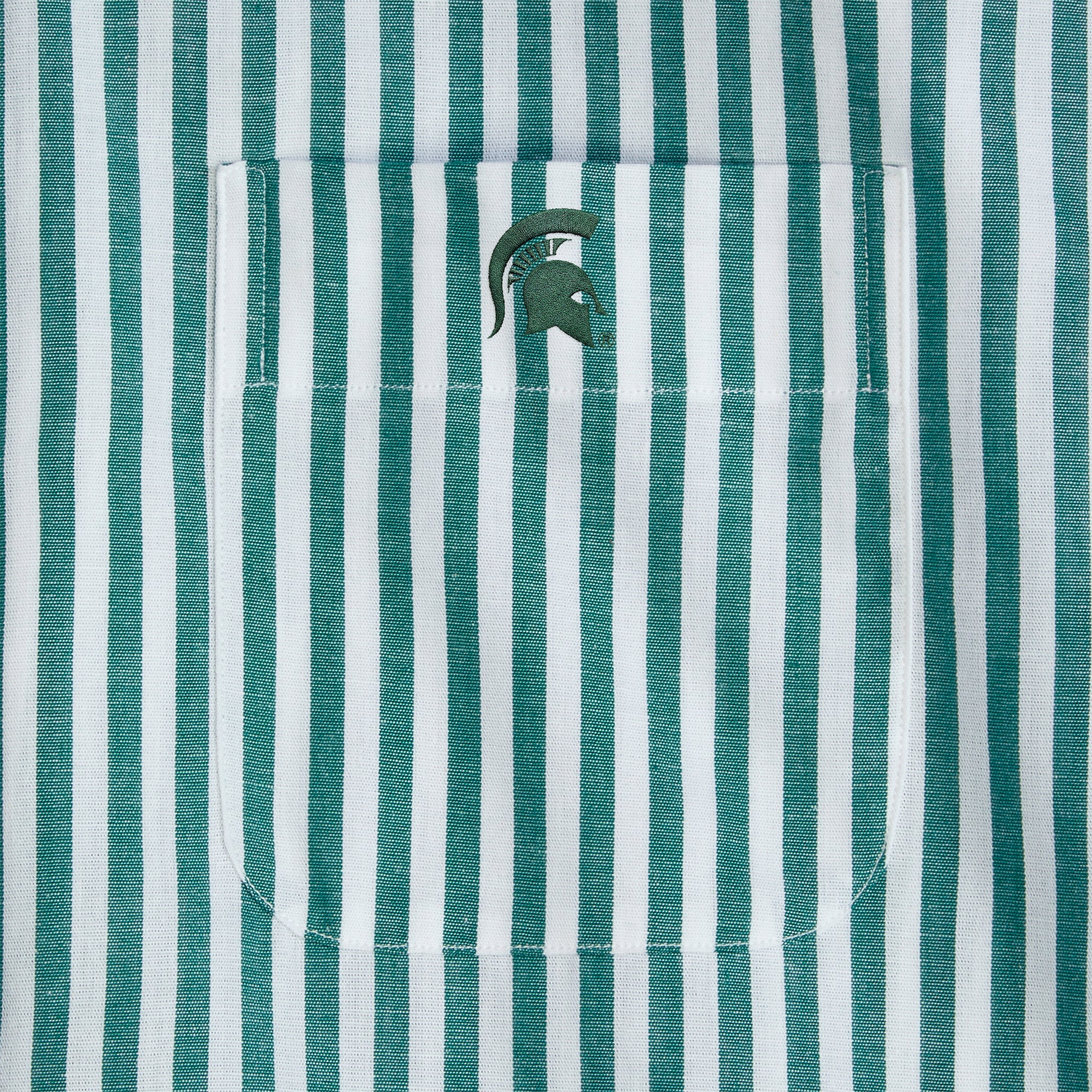 Green and white striped shirt pocket with stitched Spartan helmet logo. Class Trip | Officially Licensed Collegiate Apparel