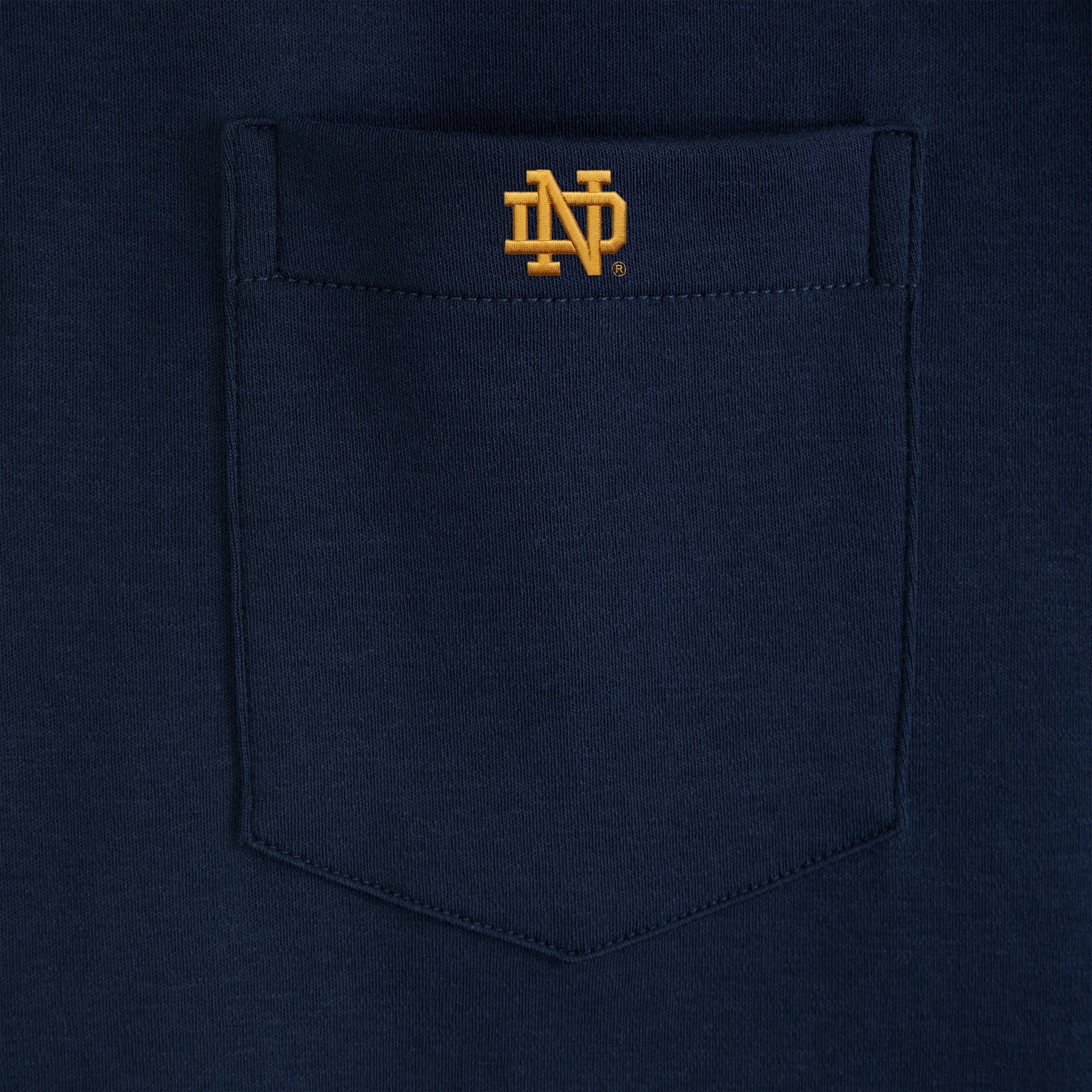 Navy polo shirt pocket with gold collegiate logo embroidery, Class Trip | Officially Licensed Collegiate Apparel