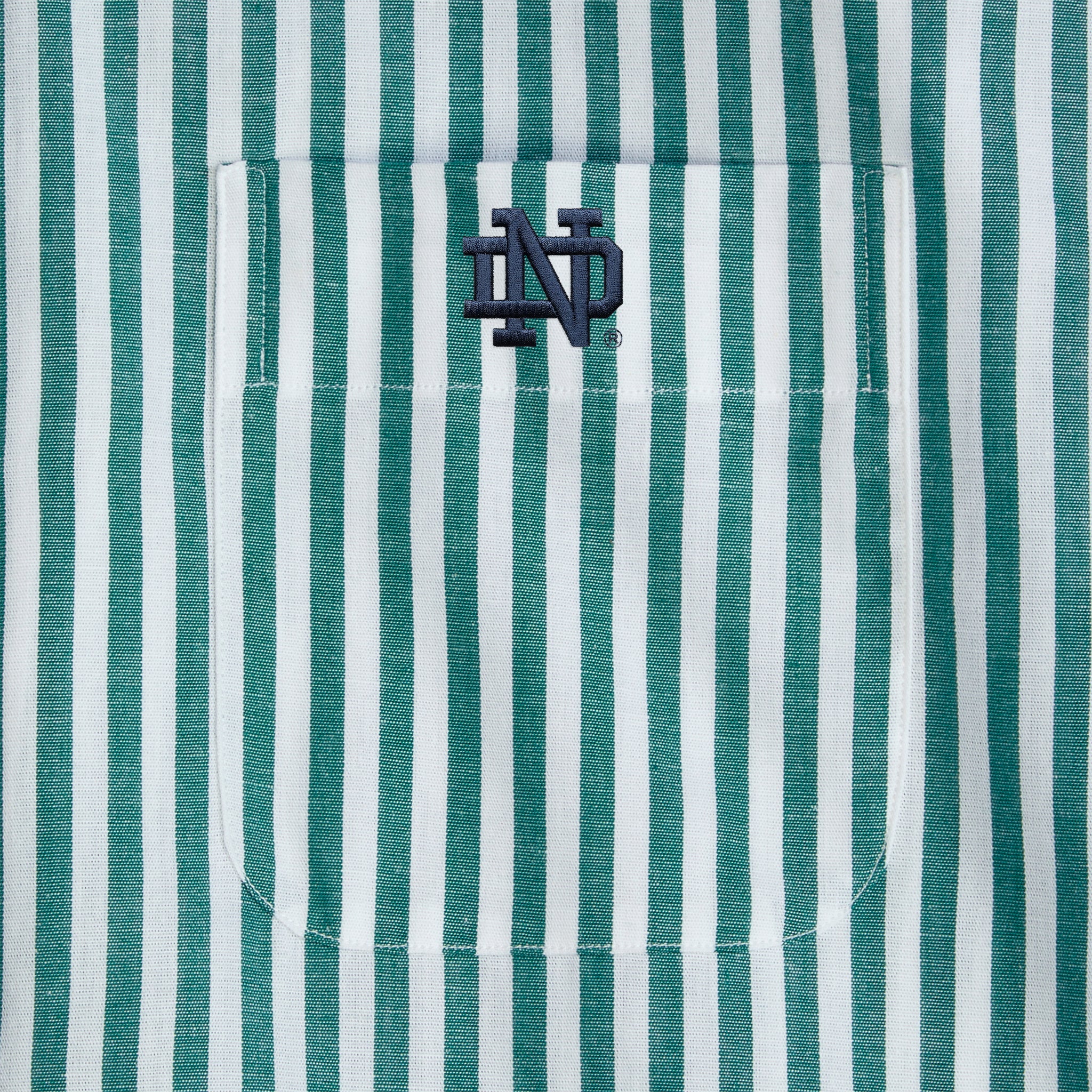 Green and white striped poplin shirt pocket with embroidered collegiate ND logo. Class Trip | Officially Licensed Collegiate Apparel
