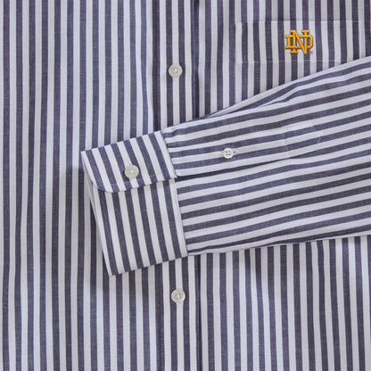 Close-up of navy and white striped poplin shirt with embroidered collegiate logo, button cuffs | Class Trip | Officially Licensed Collegiate Apparel