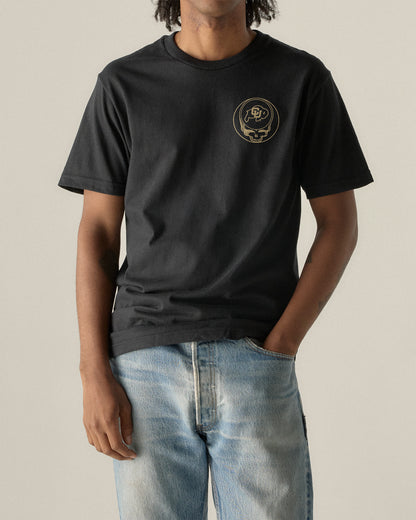 Black t-shirt with gold Grateful Dead skull and CU logo, paired with light denim jeans. Class Trip | Higher Education