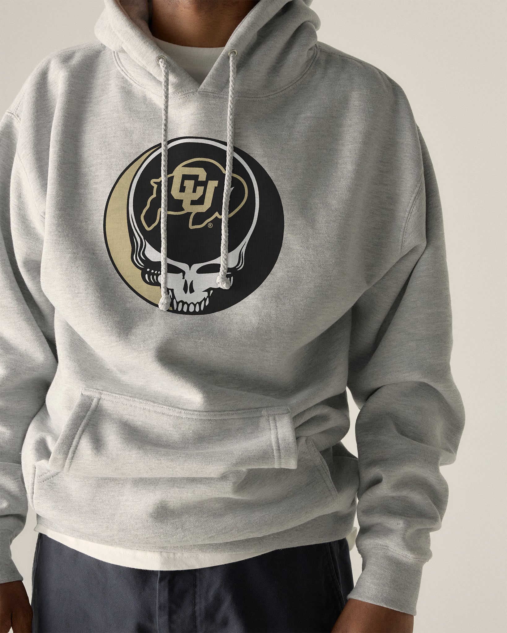 Gray hoodie with Colorado Buffaloes Grateful Dead skull logo, campus style apparel. Class Trip | Higher Education