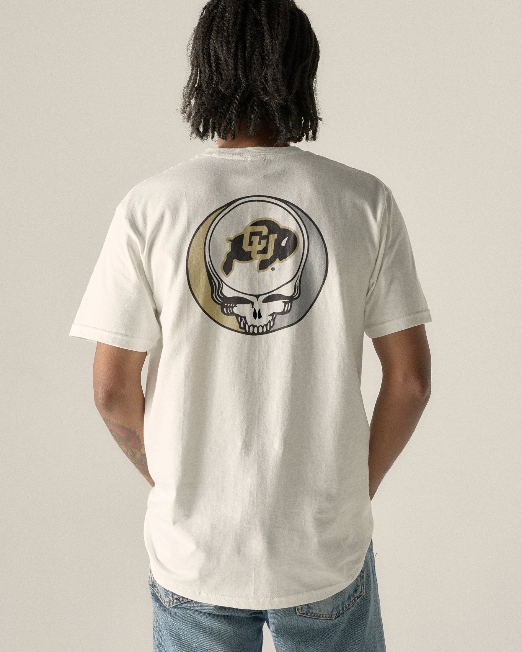 Cream t-shirt with Colorado Buffaloes Grateful Dead skull logo, back view. Class Trip | Higher Education