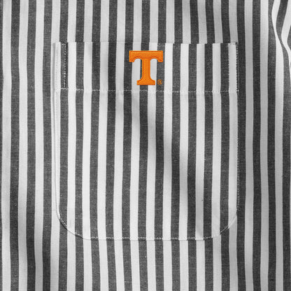 Close-up of black and white striped men's shirt pocket with orange collegiate logo, Class Trip | Officially Licensed Collegiate Apparel