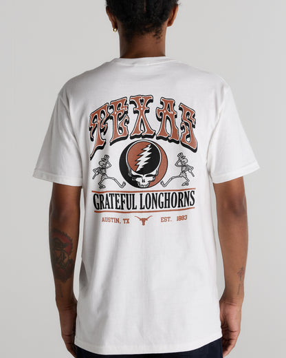Back view of a person wearing a white Texas x Grateful Dead Shakedown Tee by Class Trip | Higher Education