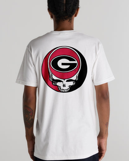 Model wearing the White Georgia x Grateful Dead Steal Your Face Tee, back view. Class Trip | Higher Education