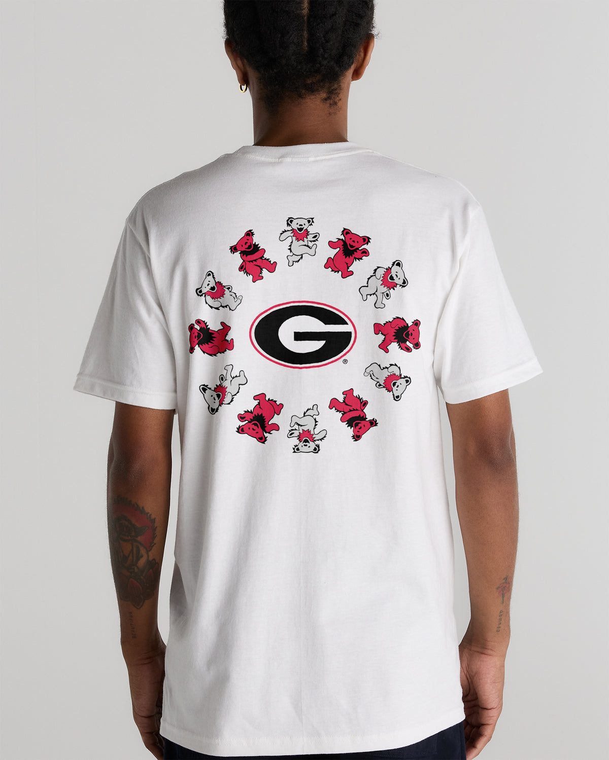 Model wearing the White Georgia x Grateful Dead Circle Bears Tee, back view. Class Trip | Higher Education
