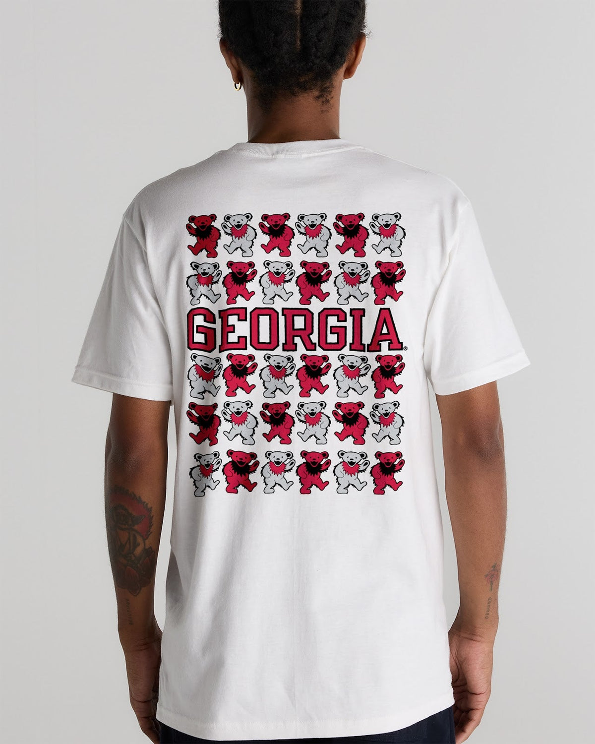 Model wearing the White Georgia x Grateful Dead Stacked Bears Tee, back view. Class Trip | Higher Education