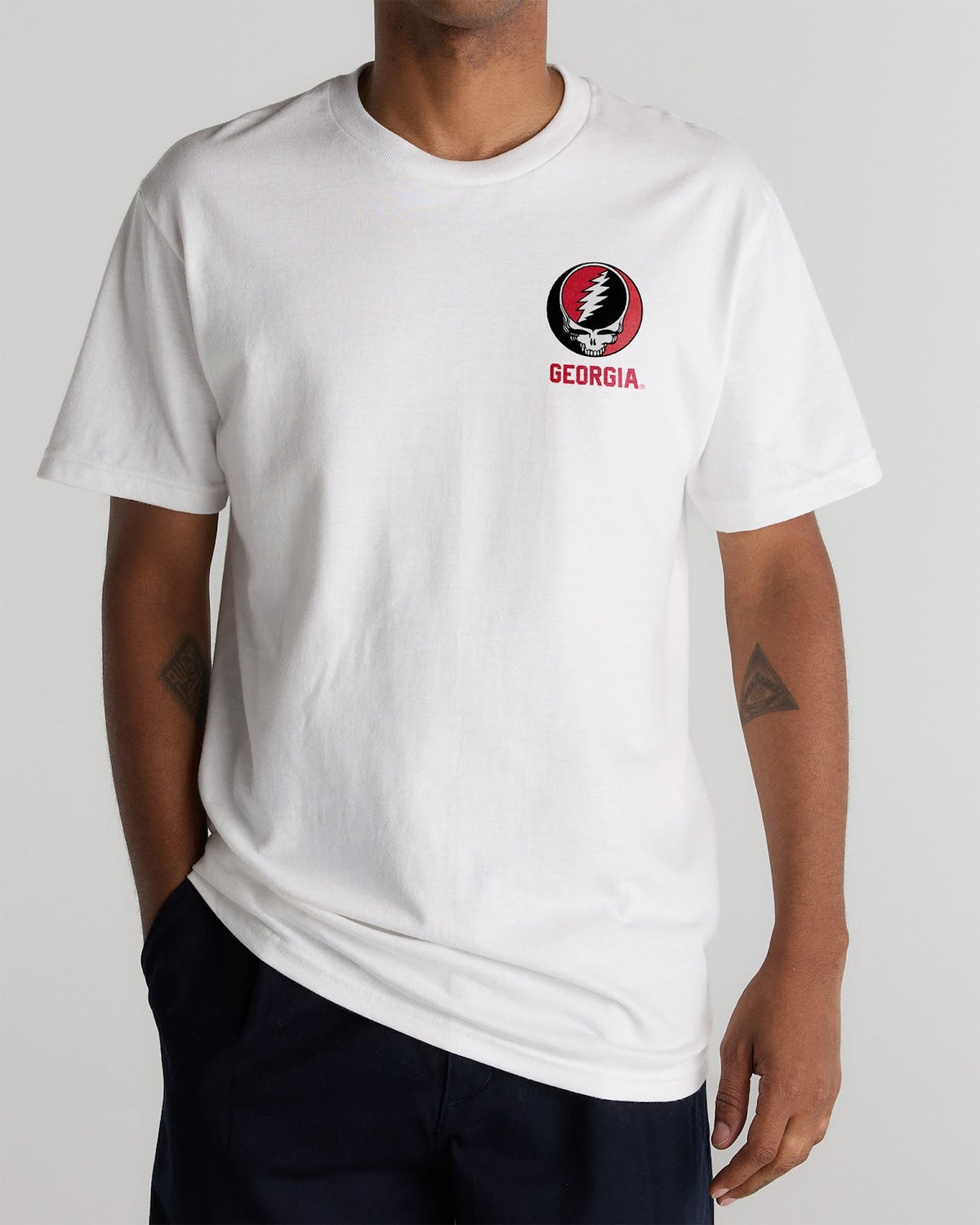 Model wearing the White Georgia x Grateful Dead Shakedown Tee, front view. Class Trip | Higher Education