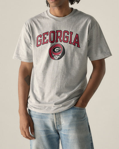 Model wearing the Heather Grey Georgia x Grateful Dead Arch Steal Your Face Tee, front view. Class Trip | Higher Education