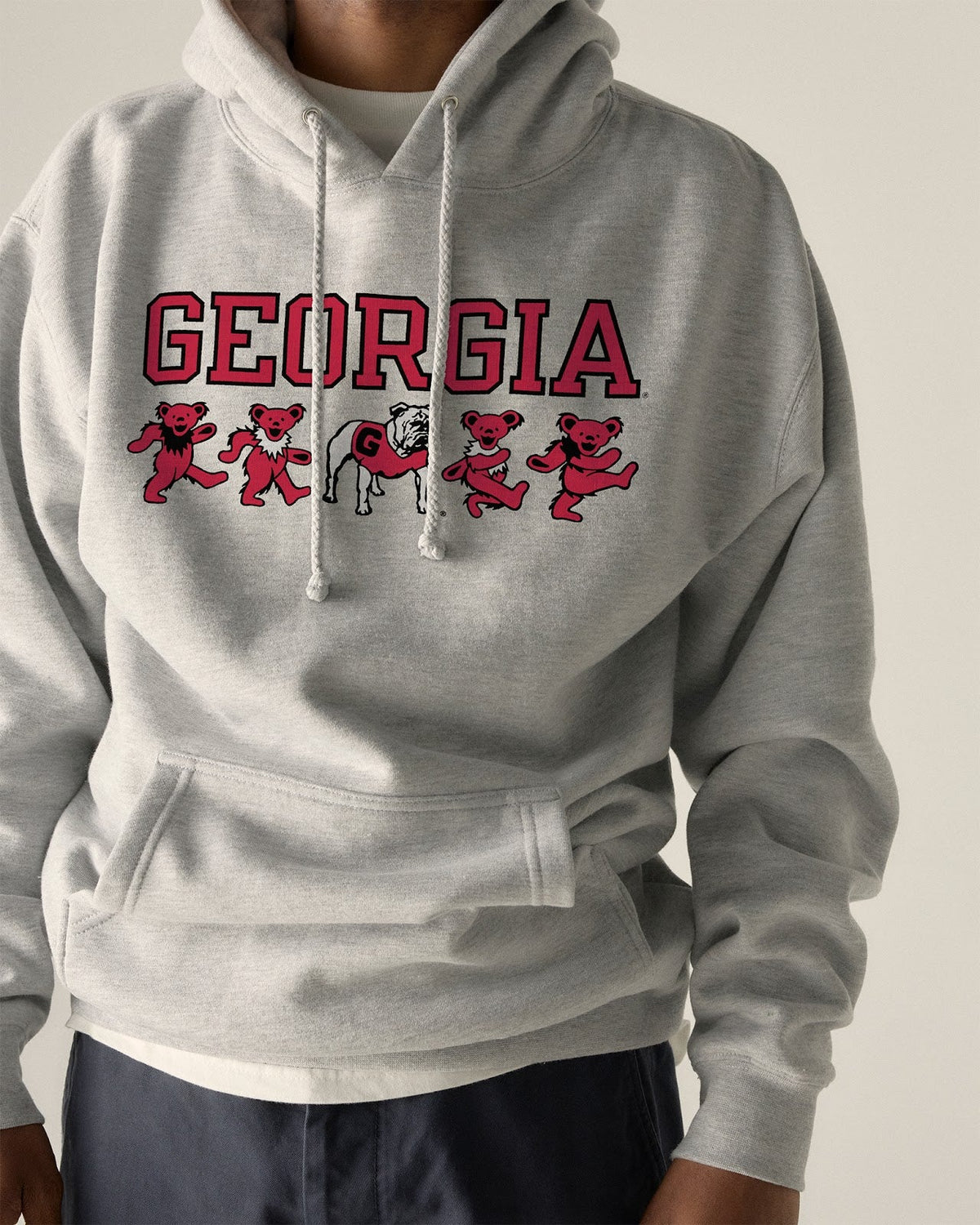 Model wearing the Heather Grey Georgia x Grateful Dead Mascot Bears Hoodie, front view. Class Trip | Higher Education