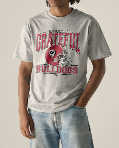 Model wearing the Heather Grey Georgia x Grateful Dead Steal Your Helmet Tee, front view. Class Trip | Higher Education