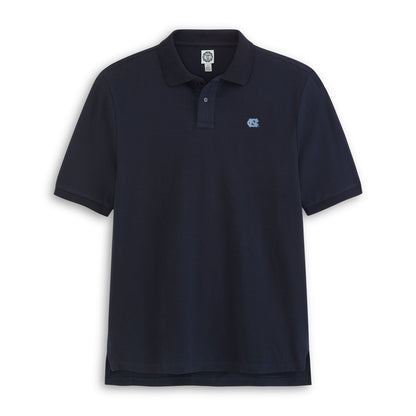 Navy blue UNC polo shirt with light blue logo, classic fit, officially licensed collegiate apparel. Class Trip | Officially Licensed Collegiate Apparel