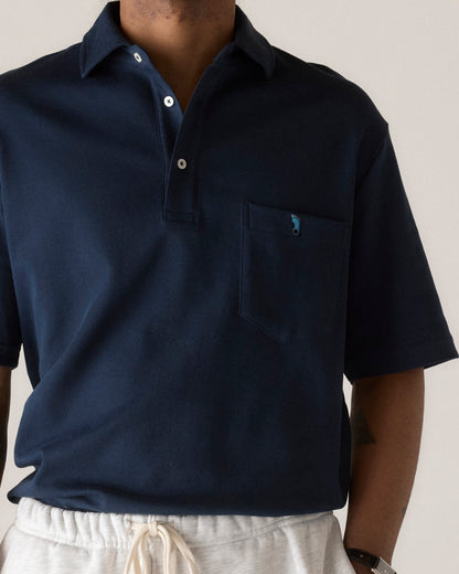 Navy polo shirt with foot logo on chest pocket, Class Trip | Officially Licensed Collegiate Apparel