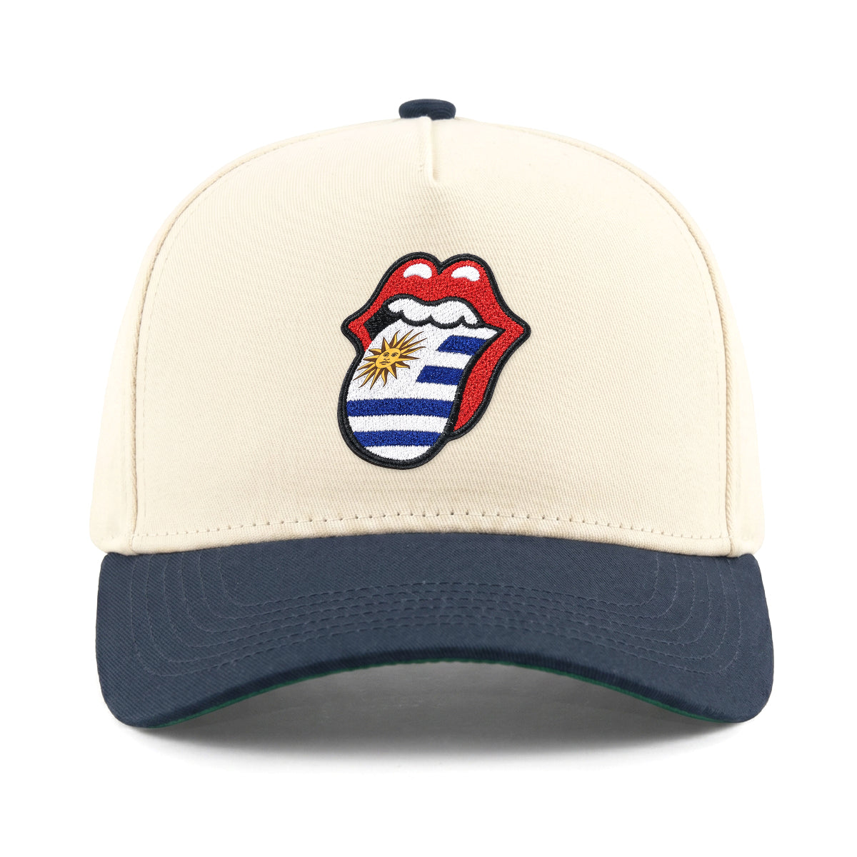 Cream and navy cap with Uruguay flag tongue logo, collegiate style. Class Trip | Higher Education